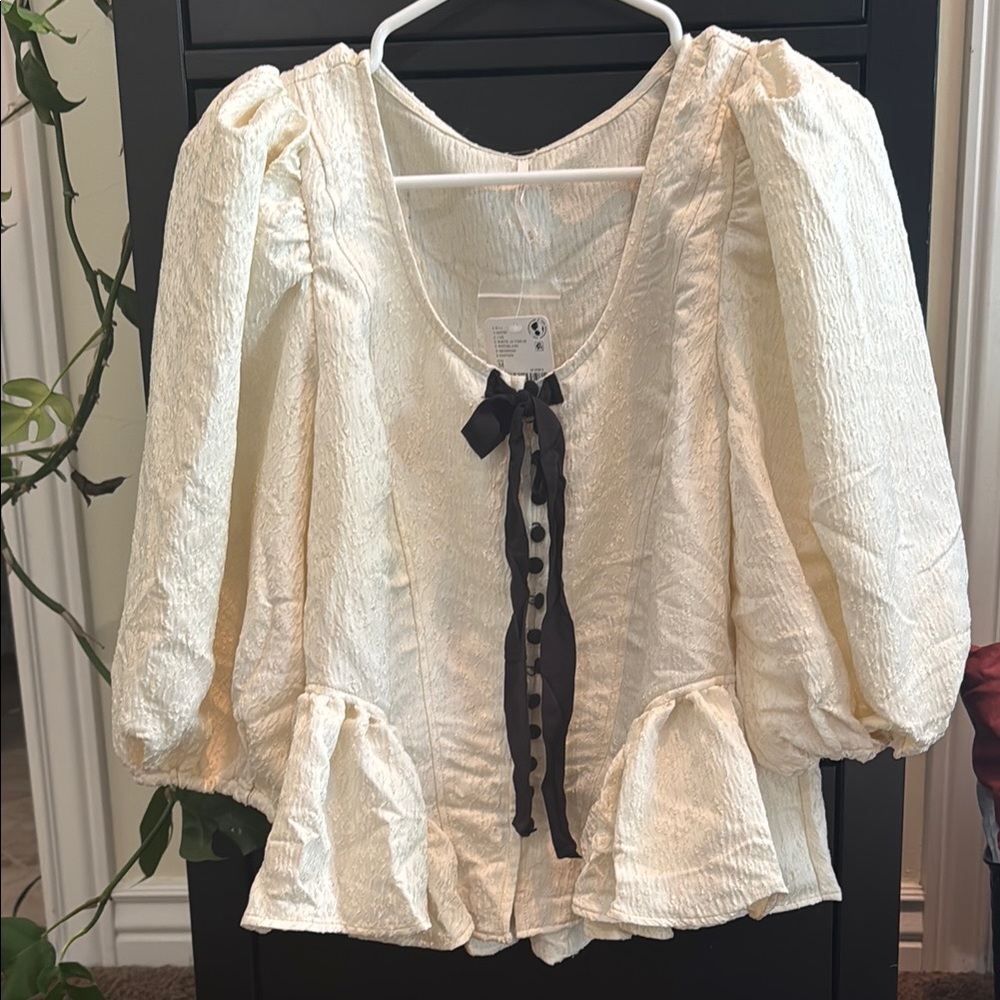 Elegant Cream Blouse with Black Ribbon